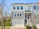 Charming two-story townhome with gray siding, white trim, and a one-car garage at 591 Mclernon Trace, Johns Island, SC 29455