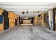 View of a finished garage with a bar area, wood paneling, and sports decor at 591 Mclernon Trace, Johns Island, SC 29455