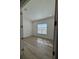 Sunlit bedroom featuring wood-look floors, recessed lighting, and a window with bright natural light at 631 Marsh Cove Cir, Summerville, SC 29486