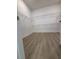 Walk-in closet with white wire shelves and wooden floor at 631 Marsh Cove Cir, Summerville, SC 29486