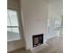 Living room with black fireplace and many windows to let in the natural light at 631 Marsh Cove Cir, Summerville, SC 29486