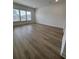 An open living room with natural lighting and wooden floors at 631 Marsh Cove Cir, Summerville, SC 29486