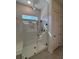 Tiled walk-in shower with glass partition and bench seat at 631 Marsh Cove Cir, Summerville, SC 29486