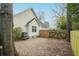 Backyard view features the home's exterior, a wooden fence, and partial privacy at 642 Bridlewood Ln, Mount Pleasant, SC 29466