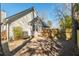 View of the backyard featuring a wooden fence, trees, and the home's exterior at 642 Bridlewood Ln, Mount Pleasant, SC 29466