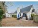 Spacious backyard features a patio with an umbrella table and a home with sliding glass doors at 642 Bridlewood Ln, Mount Pleasant, SC 29466