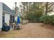 Backyard features a patio with table and chairs, lush trees and partial fencing at 642 Bridlewood Ln, Mount Pleasant, SC 29466