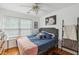 Cozy bedroom with wood floors, large window and stylish furnishings at 642 Bridlewood Ln, Mount Pleasant, SC 29466