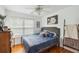 Cozy bedroom with wood floors, large window and stylish furnishings at 642 Bridlewood Ln, Mount Pleasant, SC 29466