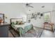 Bright bedroom with vaulted ceiling, stylish decor, and a colorful rug at 642 Bridlewood Ln, Mount Pleasant, SC 29466