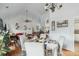 Dining room area that leads into the living room with a ceiling fan, light fixture, and hardwood flooring at 642 Bridlewood Ln, Mount Pleasant, SC 29466