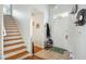 Bright foyer with tile flooring, staircase, and coat rack, offering a welcoming entrance at 642 Bridlewood Ln, Mount Pleasant, SC 29466