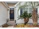 Inviting front entrance with a charming floral wreath and a well-manicured yard at 642 Bridlewood Ln, Mount Pleasant, SC 29466