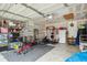 Spacious garage converted to a well-equipped gym with fitness equipment and ample storage shelves at 642 Bridlewood Ln, Mount Pleasant, SC 29466