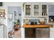 Kitchen with butcher block countertops, subway tile backsplash, and stainless steel appliances, with dog bowls on the floor at 642 Bridlewood Ln, Mount Pleasant, SC 29466