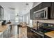 Modern kitchen flows into a comfortable living area, featuring stainless appliances and butcher block counters at 642 Bridlewood Ln, Mount Pleasant, SC 29466