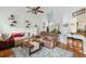 Cozy living room with vaulted ceilings, planked accent walls, and hardwood floors at 642 Bridlewood Ln, Mount Pleasant, SC 29466