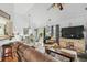 Bright open-concept living area with hardwood floors, dining space, and natural light at 642 Bridlewood Ln, Mount Pleasant, SC 29466