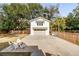 Gravel backyard features guest house, firepit, and fenced yard at 668 Ferry St, Mount Pleasant, SC 29464