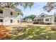 Lush backyard with a view of the house and covered patio at 668 Ferry St, Mount Pleasant, SC 29464
