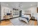 Charming bedroom featuring hardwood floors, a ceiling fan, and a cozy desk area at 668 Ferry St, Mount Pleasant, SC 29464