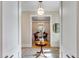 Home entryway featuring a table and view of the dining room with a decorative chandelier and wallpaper at 668 Ferry St, Mount Pleasant, SC 29464