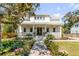 Charming two-story home featuring a spacious front porch, brick pathway, and beautifully landscaped front yard at 668 Ferry St, Mount Pleasant, SC 29464