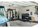 Well-equipped garage with a home gym, weights, and golf cart at 668 Ferry St, Mount Pleasant, SC 29464