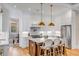 Modern kitchen featuring an island with seating, stainless steel appliances and views of the dining room at 668 Ferry St, Mount Pleasant, SC 29464