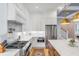 Well-equipped kitchen featuring stainless steel appliances, white cabinetry, and a marble countertop island at 668 Ferry St, Mount Pleasant, SC 29464