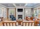Cozy living room with a fireplace, coffered ceiling, and ample seating at 668 Ferry St, Mount Pleasant, SC 29464