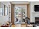 Bright living room featuring French doors to a covered patio with curtains at 668 Ferry St, Mount Pleasant, SC 29464