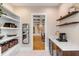 Walk-in pantry with custom shelves, wine cooler, sink, and countertop at 668 Ferry St, Mount Pleasant, SC 29464