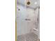 Luxurious shower with marble tile, glass enclosure, rain shower head, and built-in niche at 668 Ferry St, Mount Pleasant, SC 29464