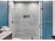 Updated shower with large marbled tiles, a glass door and chrome finishes at 668 Ferry St, Mount Pleasant, SC 29464