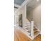 Inviting staircase featuring wood treads, white risers and railings, with natural light at 668 Ferry St, Mount Pleasant, SC 29464