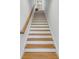 Stairway with wood treads and white risers leading up to the next floor at 668 Ferry St, Mount Pleasant, SC 29464