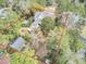Desirable real estate showcasing an expansive private property with mature trees and gardens at 710 S Main St, Summerville, SC 29483