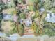 Aerial view of property showing landscaping, tree coverage, and boundary lines at 710 S Main St, Summerville, SC 29483