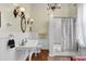 Bright bathroom with chandelier lighting and white subway tiles at 710 S Main St, Summerville, SC 29483