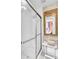Bathroom with glass shower doors and framed mirror on wall at 710 S Main St, Summerville, SC 29483