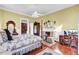 A sun-filled bedroom with a fireplace and sitting area at 710 S Main St, Summerville, SC 29483