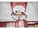 Close-up of a beautiful chandelier with decorative ceiling in a room at 710 S Main St, Summerville, SC 29483