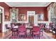 Formal dining room with large table and chairs and traditional decor at 710 S Main St, Summerville, SC 29483