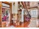 Classic foyer with hardwood floors, staircase, vintage furniture, and detailed wood paneling at 710 S Main St, Summerville, SC 29483