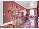 Charming hallway with hardwood floors, decorative wall art, and a beautiful chandelier at 710 S Main St, Summerville, SC 29483