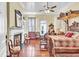 Spacious main bedroom featuring a fireplace, wood floors, and a decorative canopy bed at 710 S Main St, Summerville, SC 29483