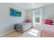 Cozy bedroom featuring two twin beds, a ceiling fan, and a mounted television at 743 Redbud Ln, Summerville, SC 29486