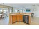 Open-concept kitchen with stainless steel appliances, a breakfast bar, and views of the living area at 743 Redbud Ln, Summerville, SC 29486