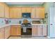 Kitchen boasts stainless steel appliances, light wood cabinets, and white countertops at 743 Redbud Ln, Summerville, SC 29486